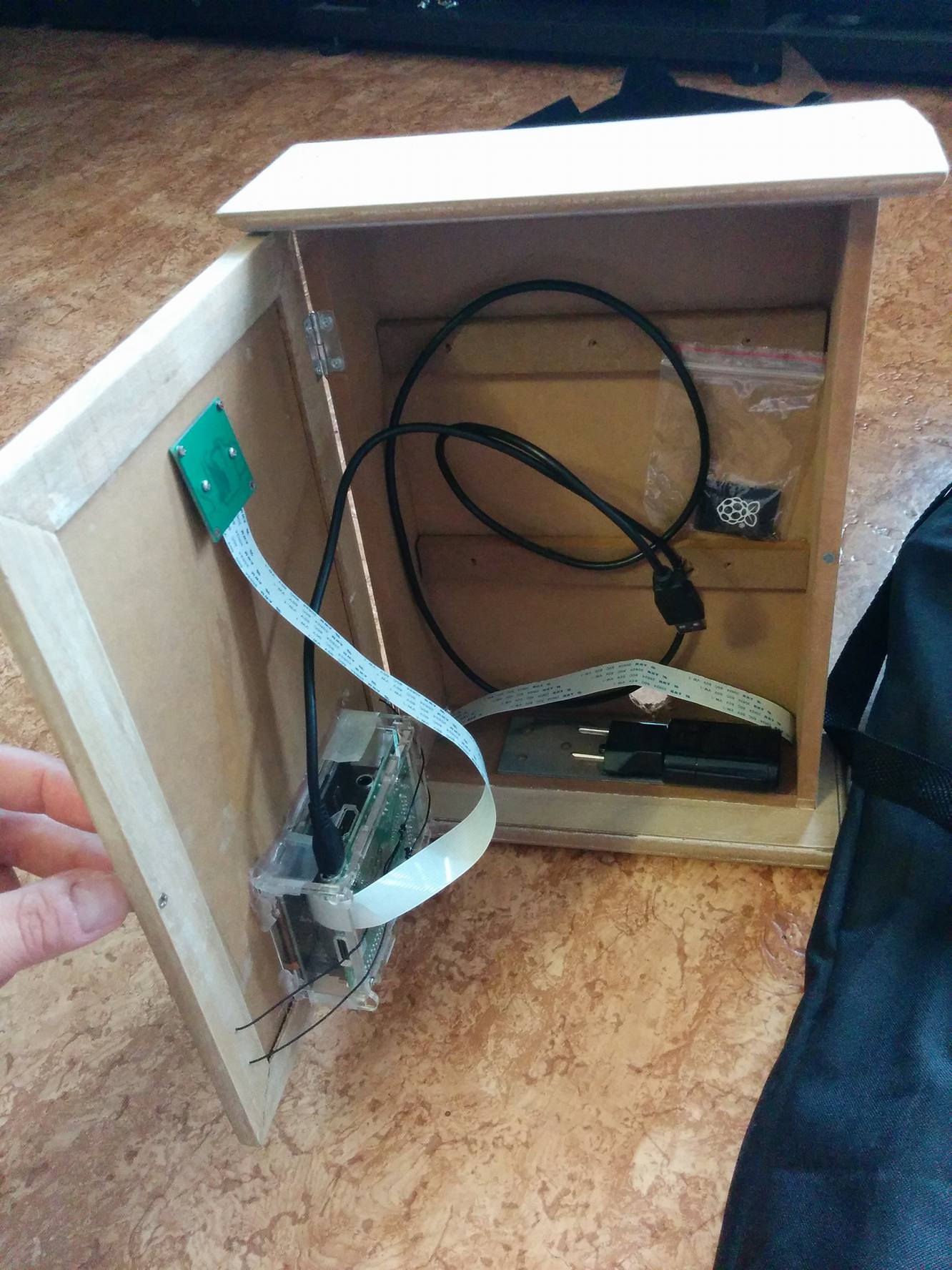 Hot glue and straps to hold things in place. The door provides easy maintenance access and insight for the technically curious.